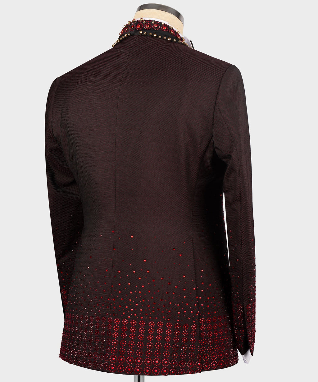 Back view burgundy tuxedo jacket with red circular pattern at the lower hem