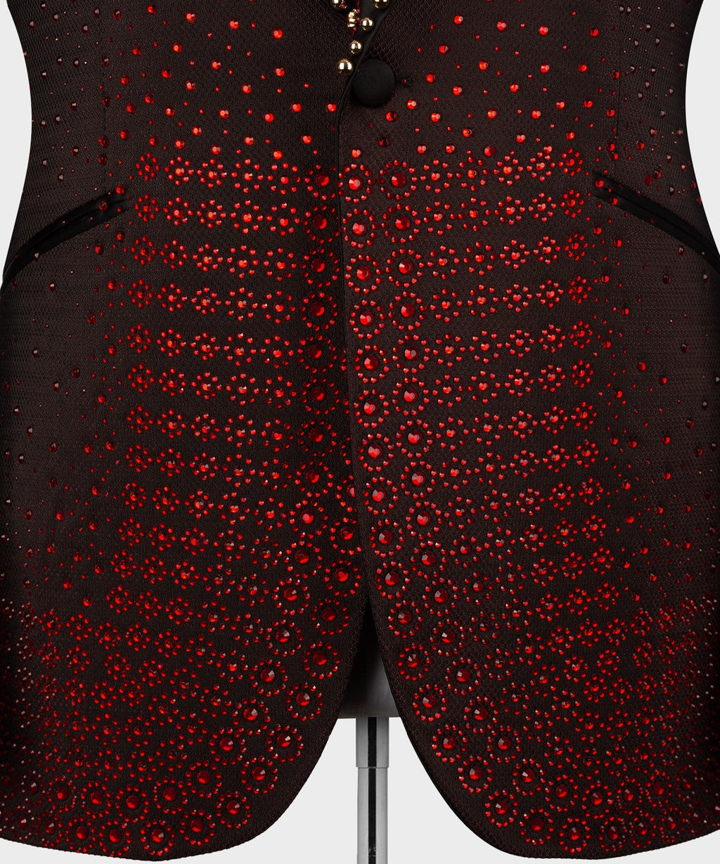 Burgundy tuxedo pants-jacket front with black button and dense red circular embellishment