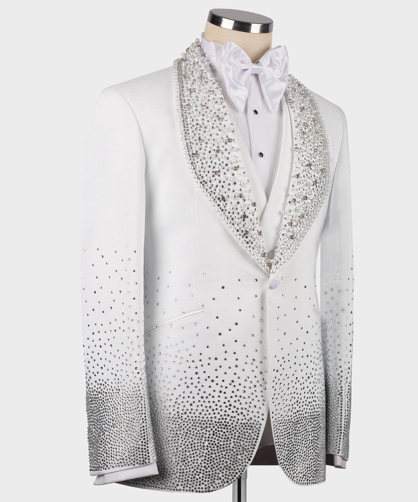 White tuxedo jacket with jeweled trim across front and long sleeves
