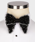 Koss Atelier black silk bow tie featuring intricate black and silver beaded detailing, styled on a white dress shirt.