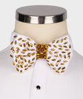 White beaded bow tie with gold and red faceted stones, round center cluster