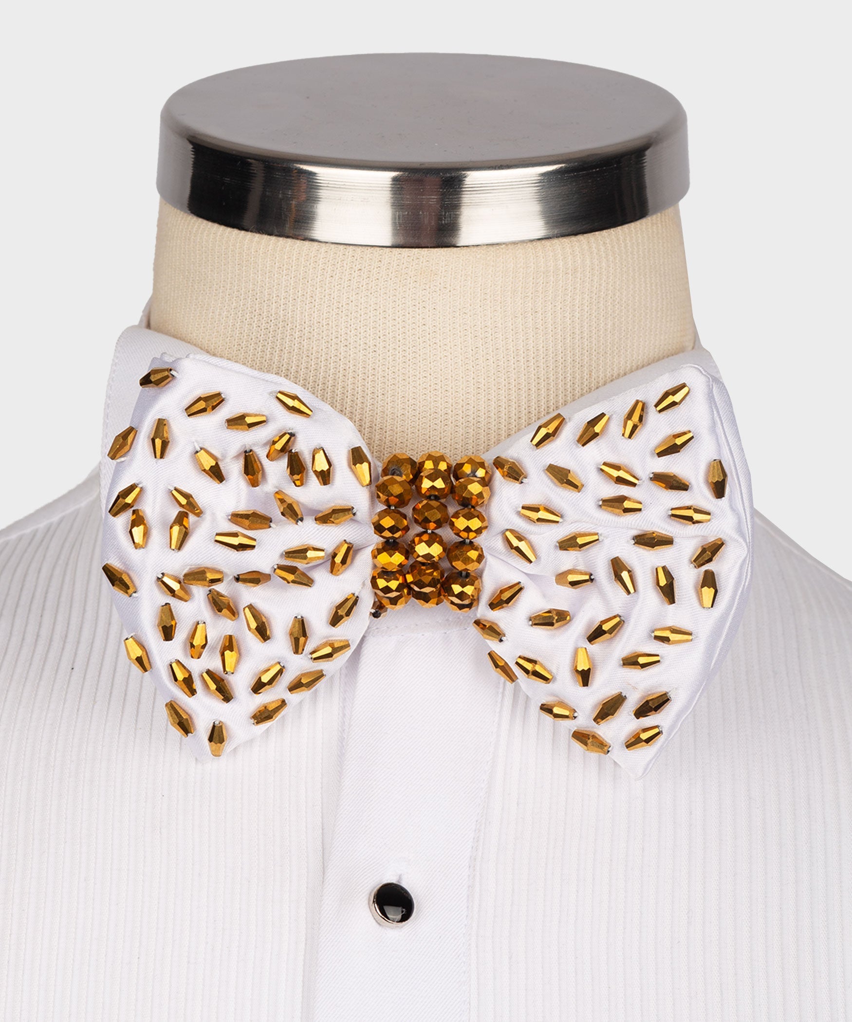 White beaded bow tie with gold and red faceted stones, round center cluster