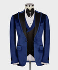 Blue velvet tuxedo jacket with satin collar, double-breasted vest, and black bow tie