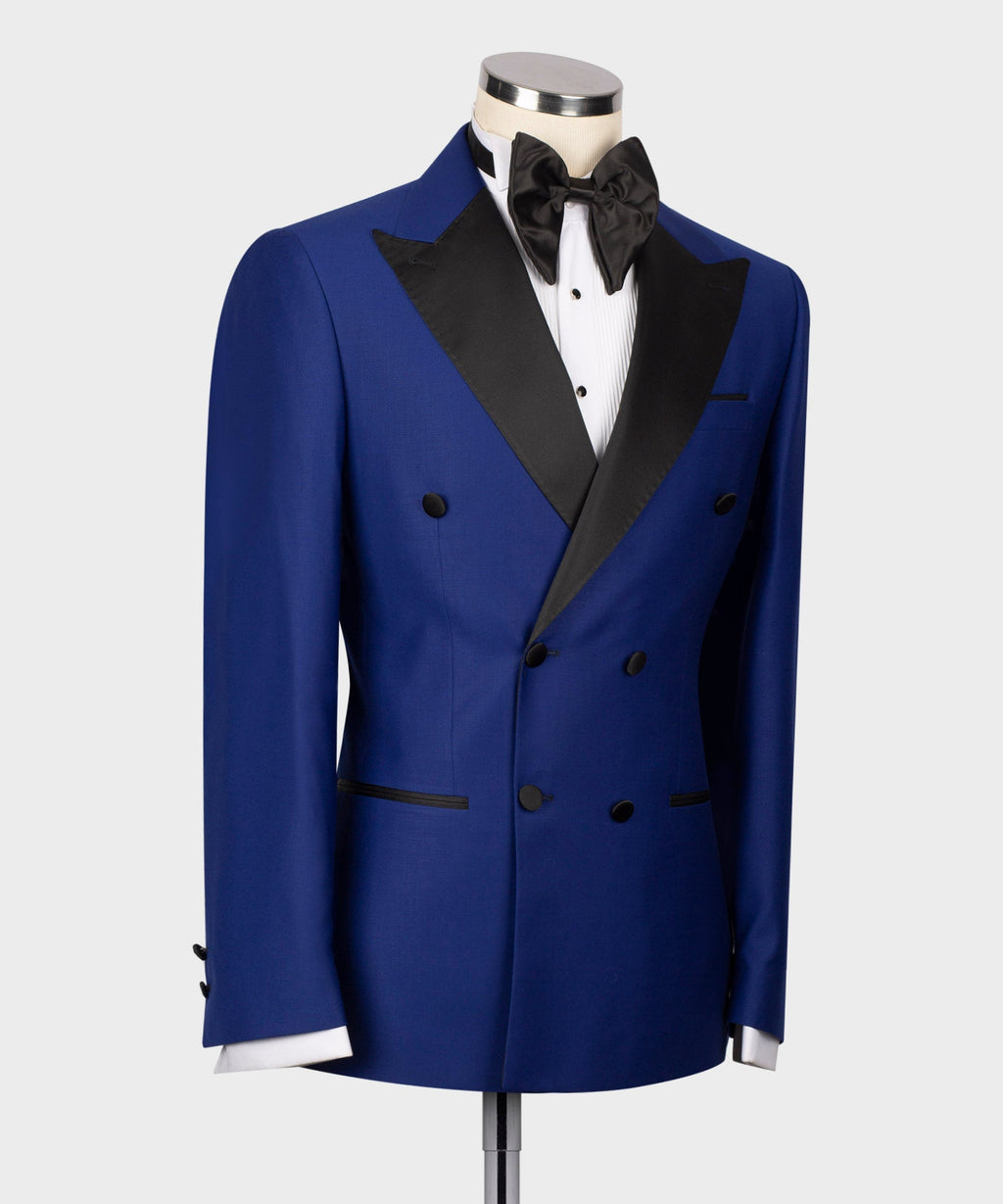 Blue tuxedo jacket with black lapels, black bow tie, and white shirt front