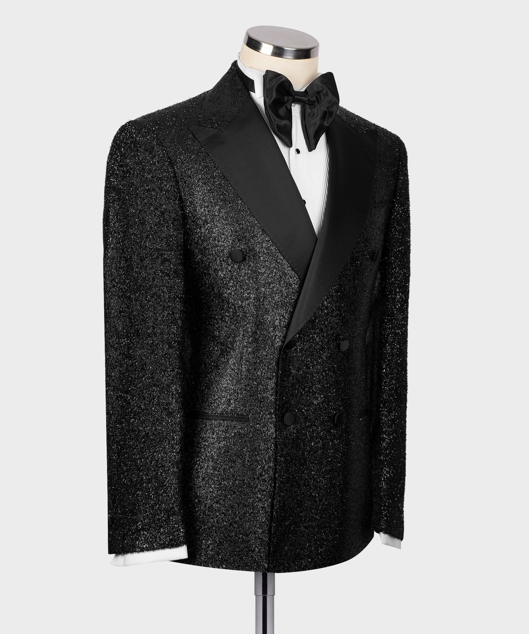 Black glitter tuxedo jacket with satin peak lapels, single-breasted front
