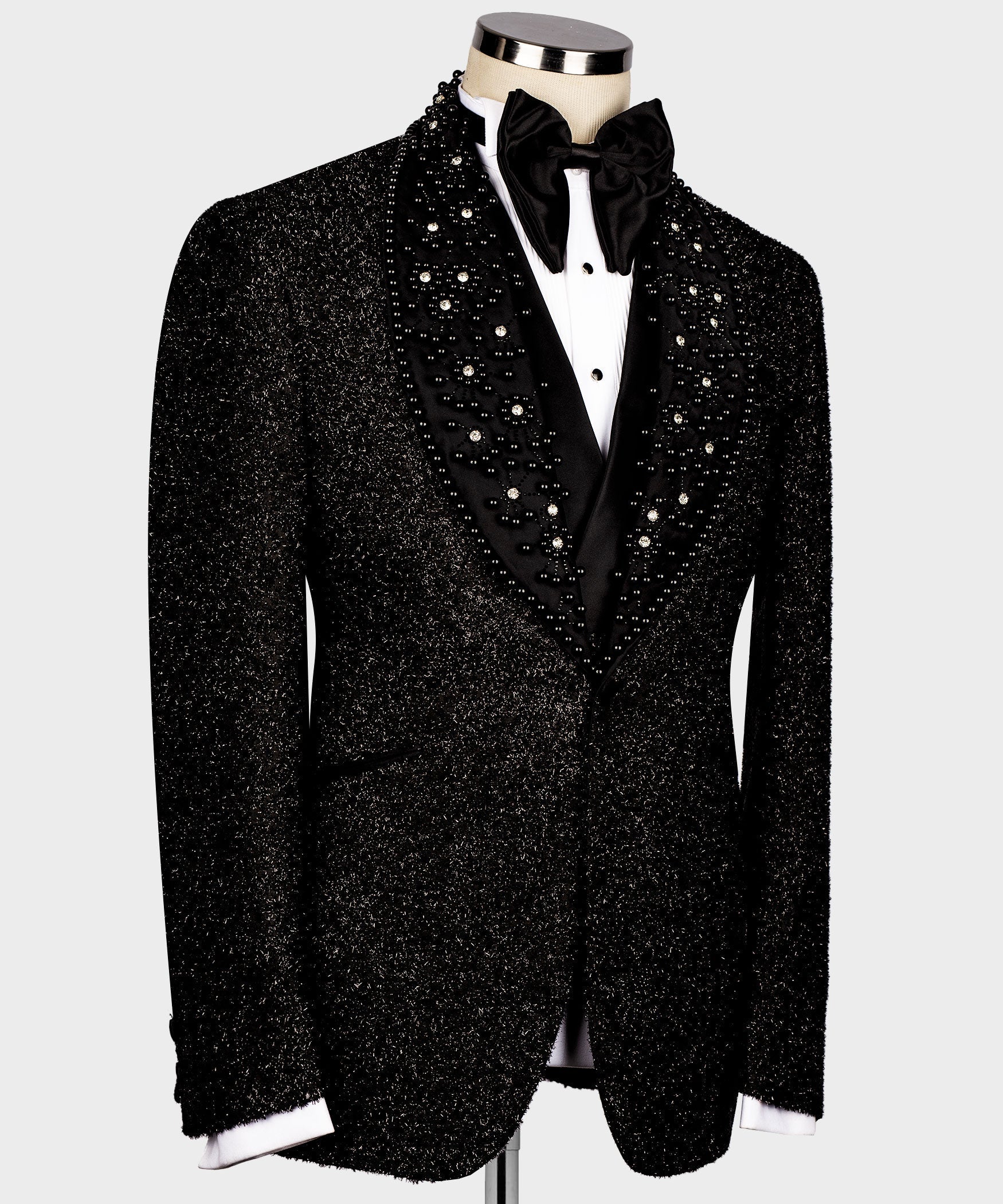 Black tuxedo jacket front view, gemstone glitter panels and shiny satin V-lapel