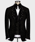 Black glitter tuxedo jacket with rhinestone accents and satin lapels, white shirt front