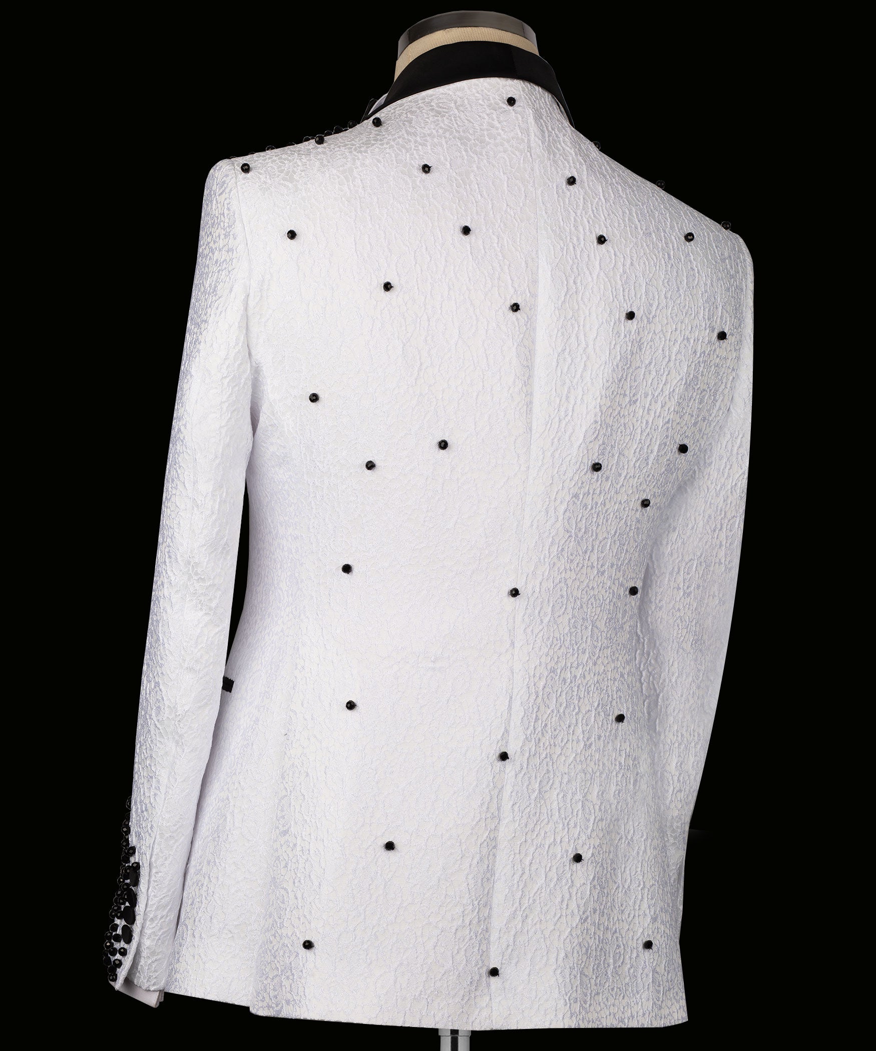 White tuxedo jacket back view with small dark dot accents across the fabric