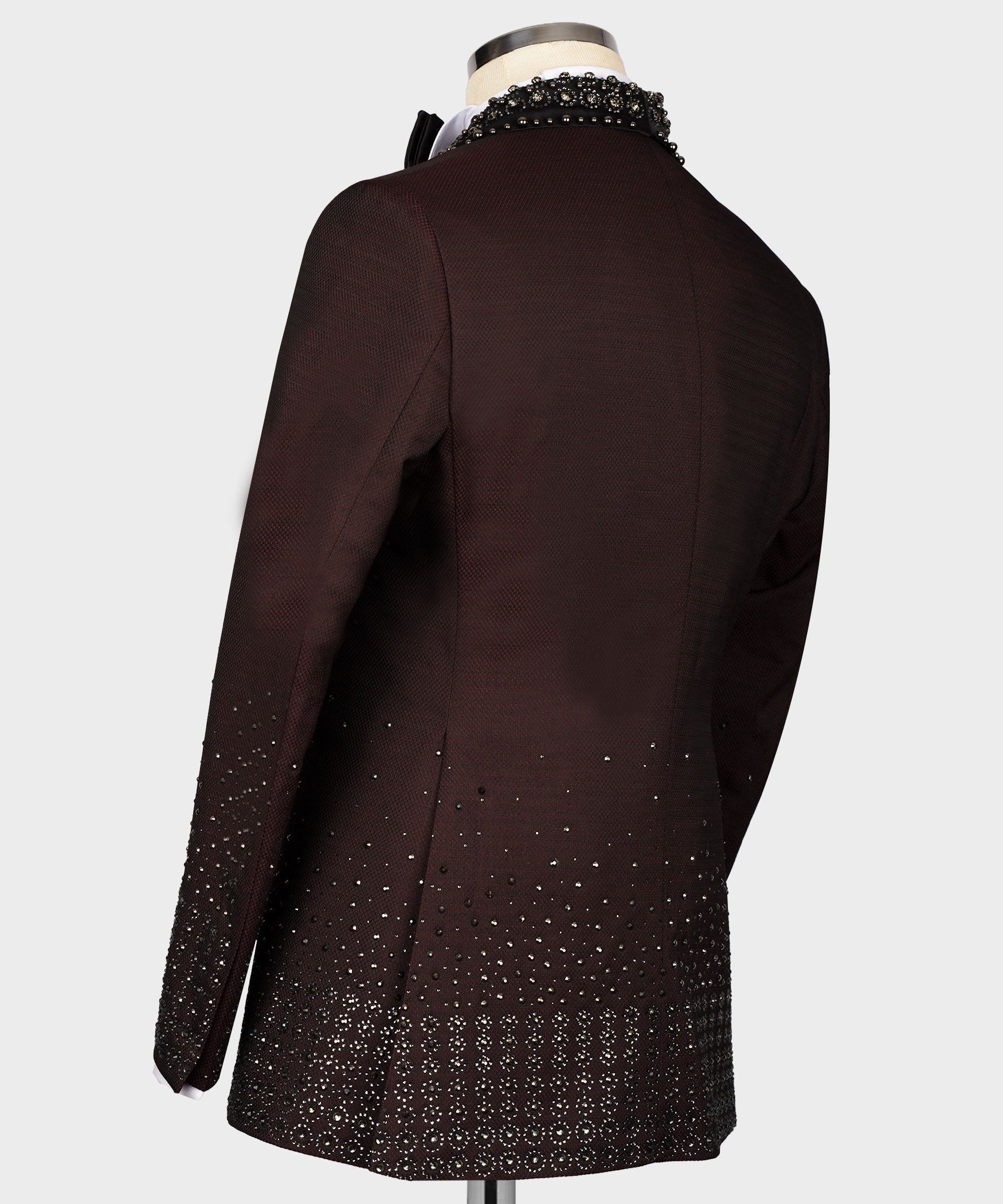 Back view of burgundy tuxedo jacket with scattered rhinestone dots along the hem