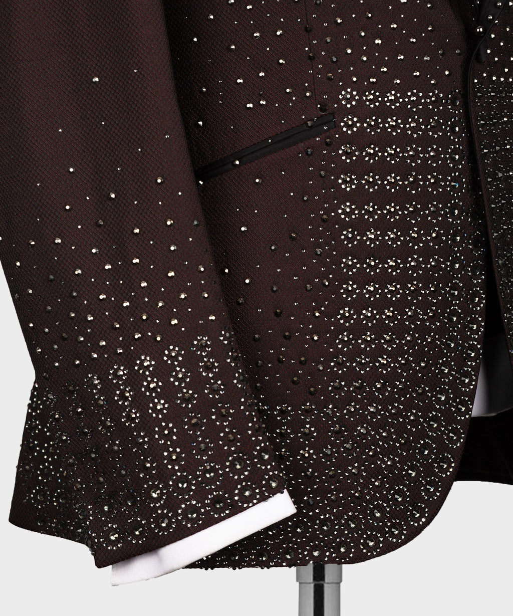 Close-up of burgundy tuxedo front with dense gold bead pattern near the pocket