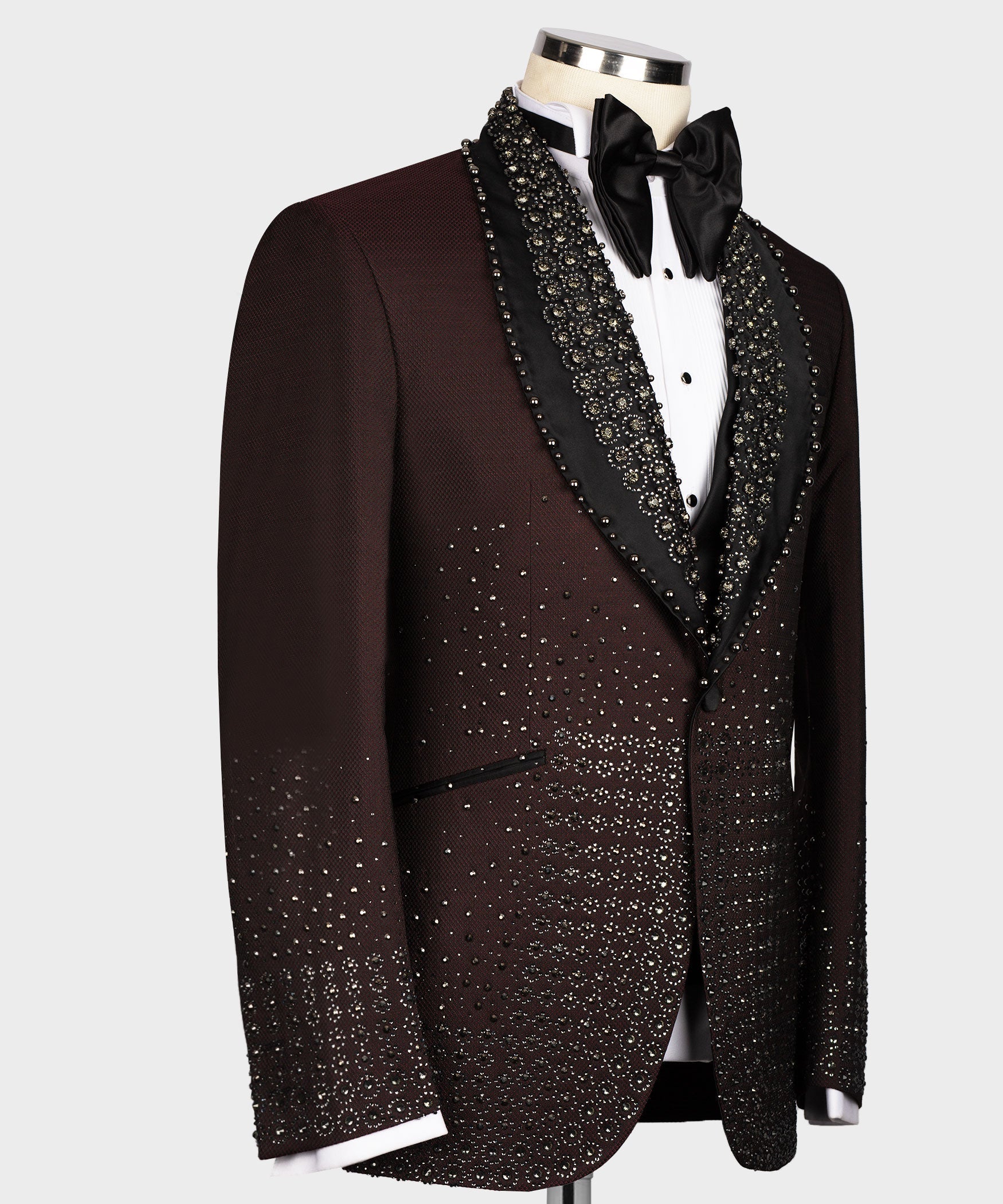 Burgundy tuxedo jacket side view with beaded black lapel trim and matching patterned fabric