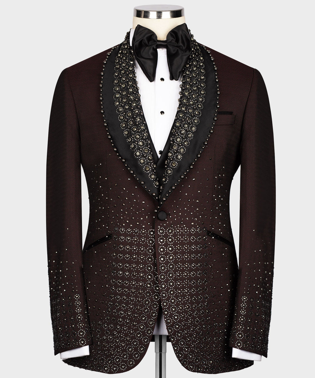 Burgundy tuxedo jacket with round lapels, black satin trim, and gold jeweled pattern