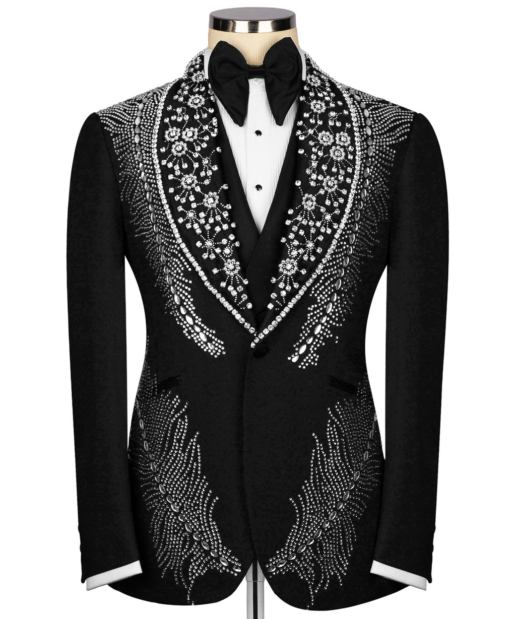 Black tuxedo jacket with jeweled floral trim, bow tie, and white vest front