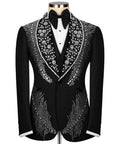 Black tuxedo jacket with jeweled floral trim, bow tie, and white vest front
