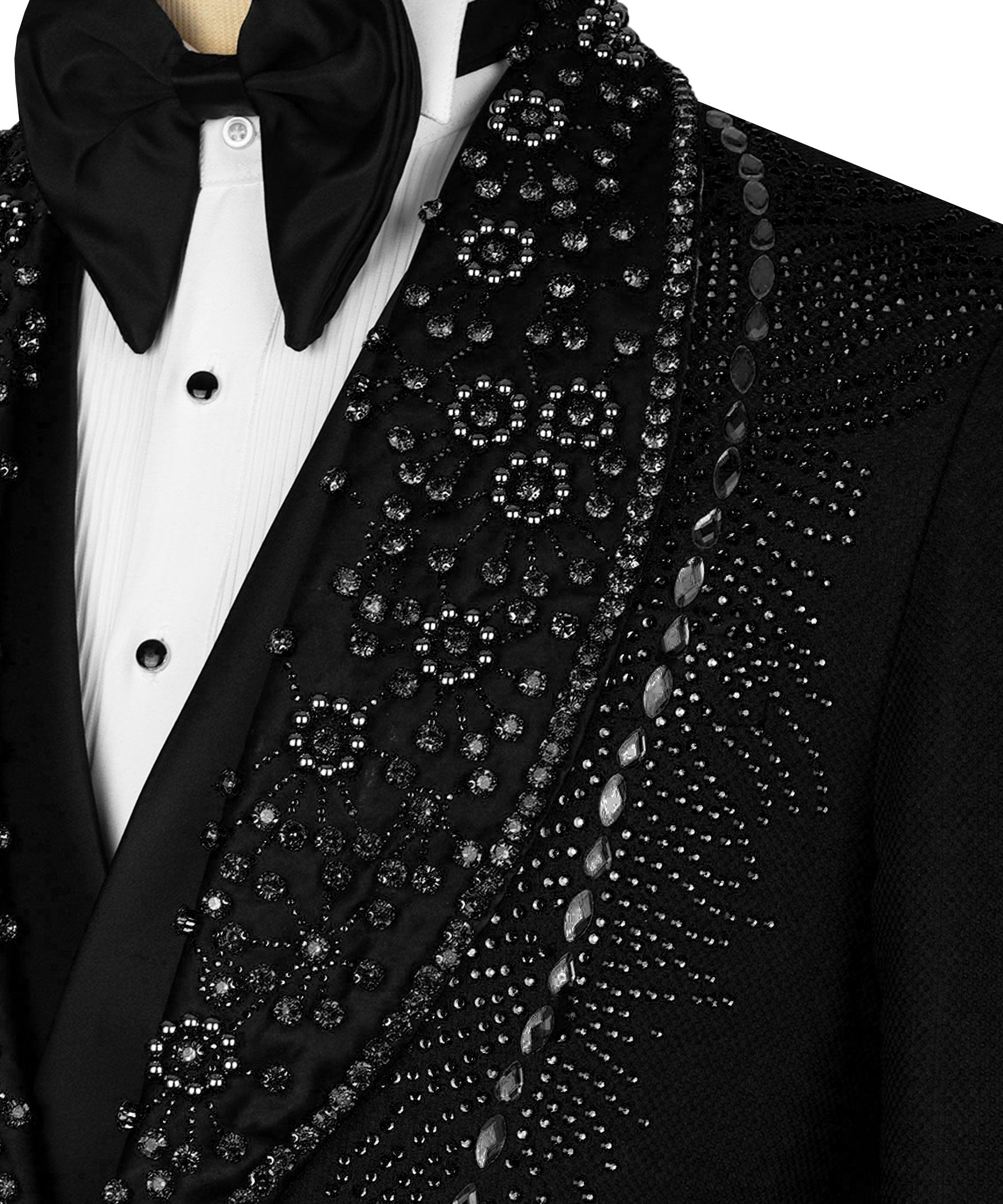 Close-up: black tuxedo lapel with ornate stone embroidery over white buttoned shirt
