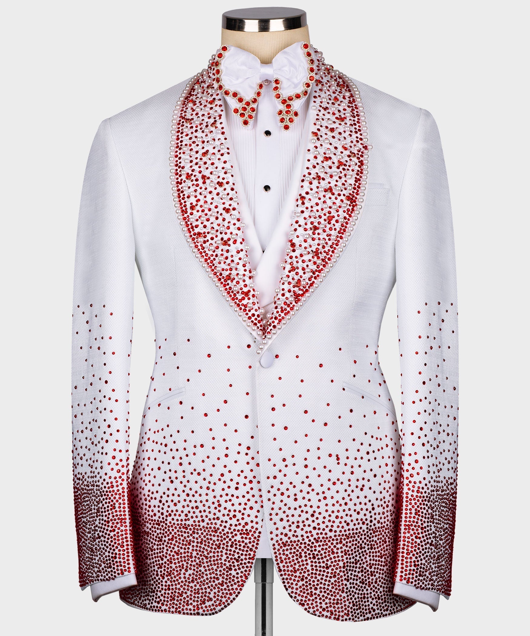 White tuxedo jacket with red stone-embroidered lapels and matching shirt bow tie