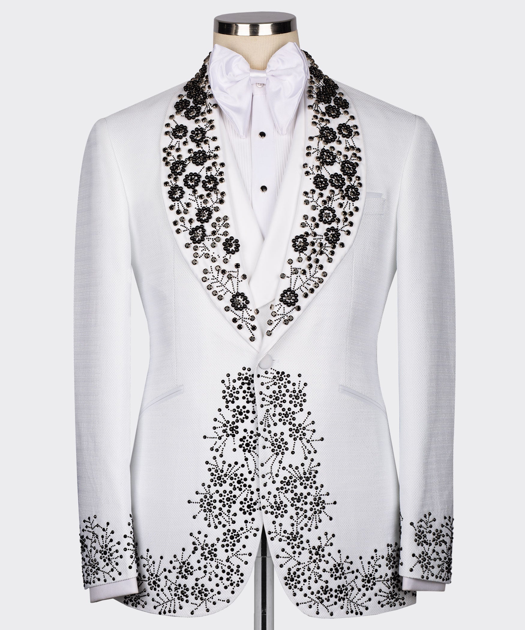 White tuxedo jacket with black gemstone embroidery on lapels and front