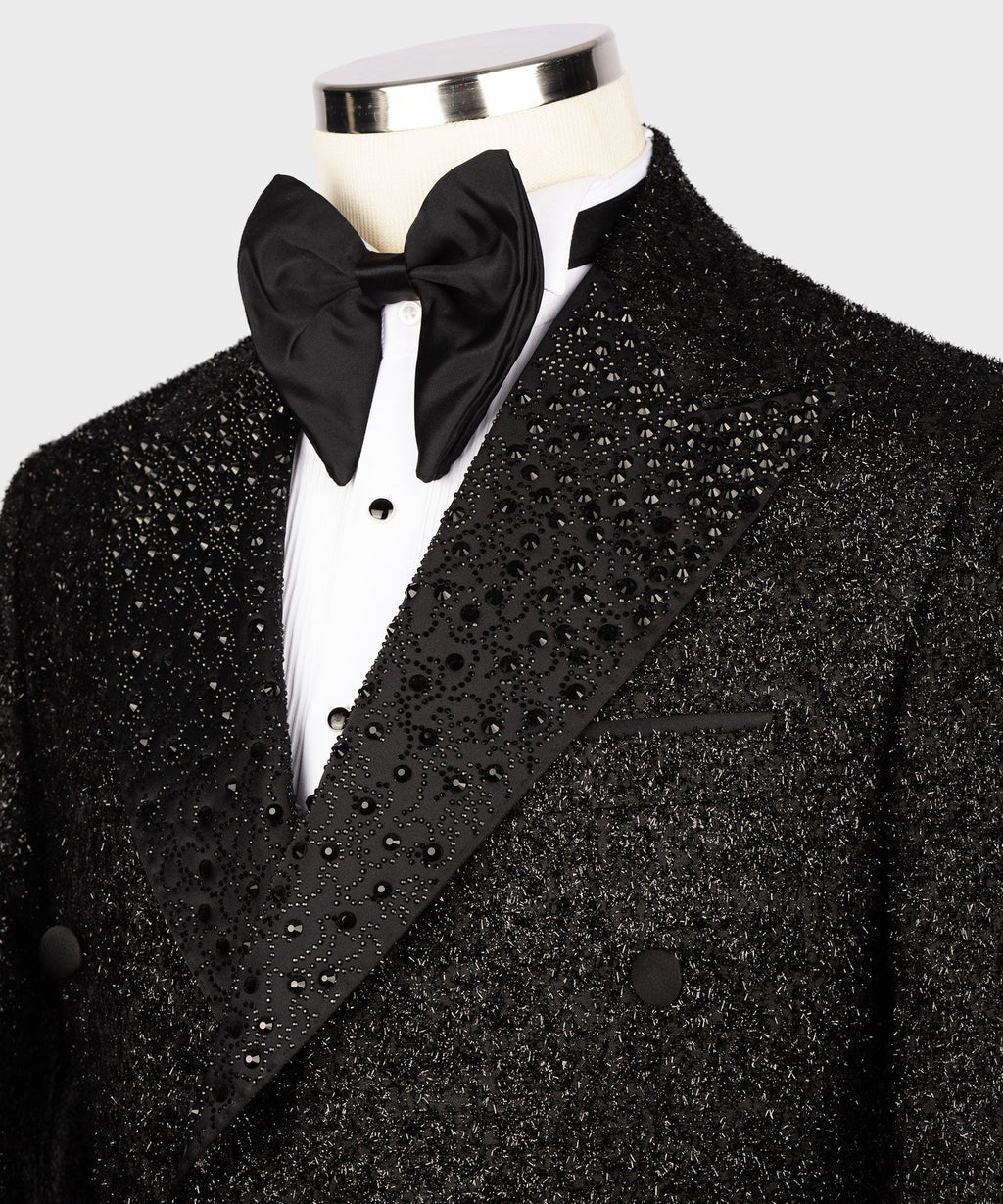 Close-up: black tuxedo lapel with gemstone embroidery and double-breasted buttons