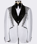 White tuxedo jacket with black embroidered lapels and feather-like stone pattern, bow tie