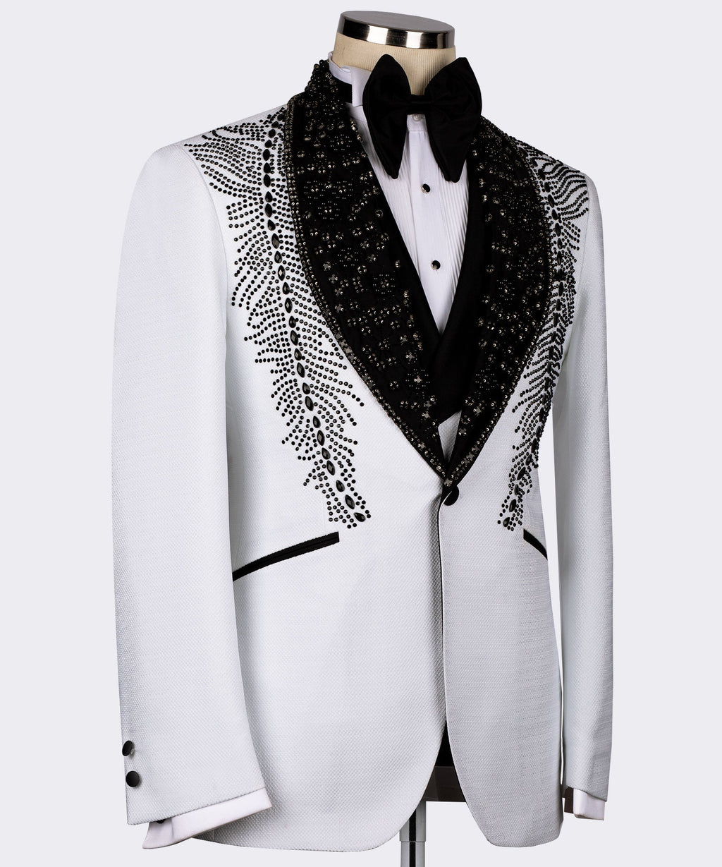 White tuxedo jacket with black lapels and feather-like stone embroidery along the sides