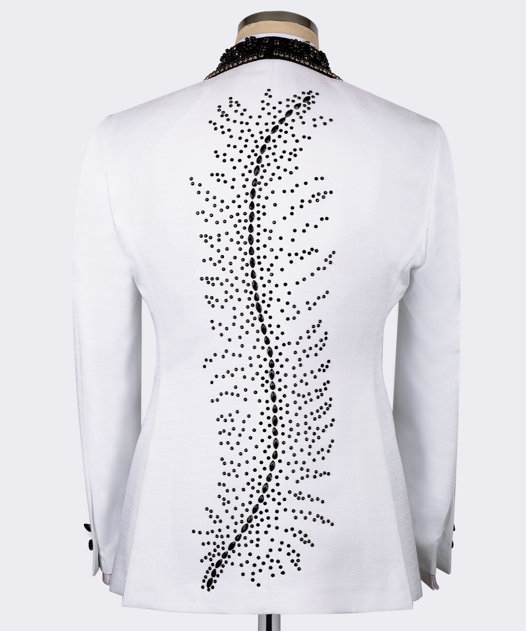 White tuxedo jacket back with dense black dot stone embroidery feather motif