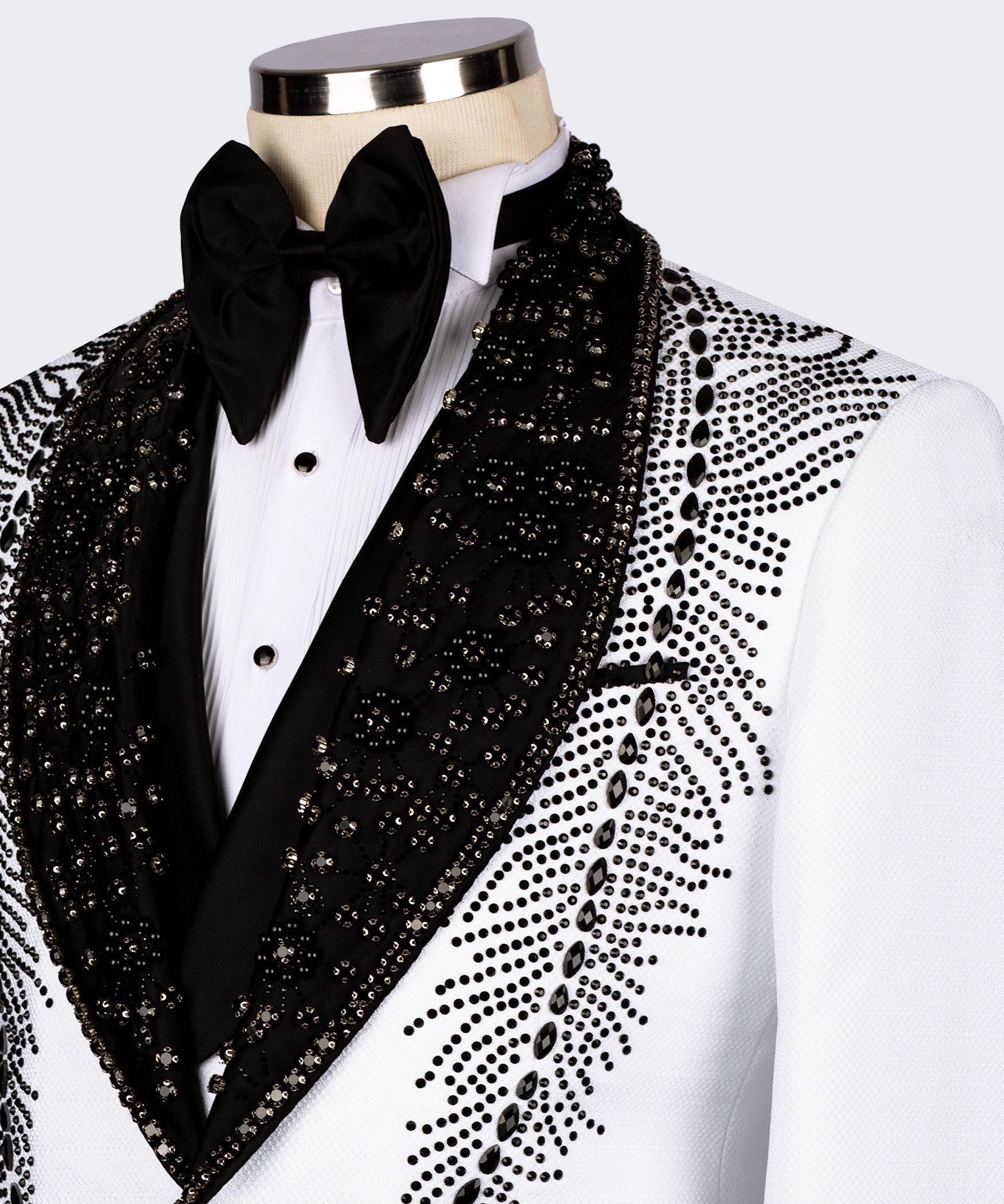 Black stone-embroidered lapels with bow tie and white tuxedo shirt front