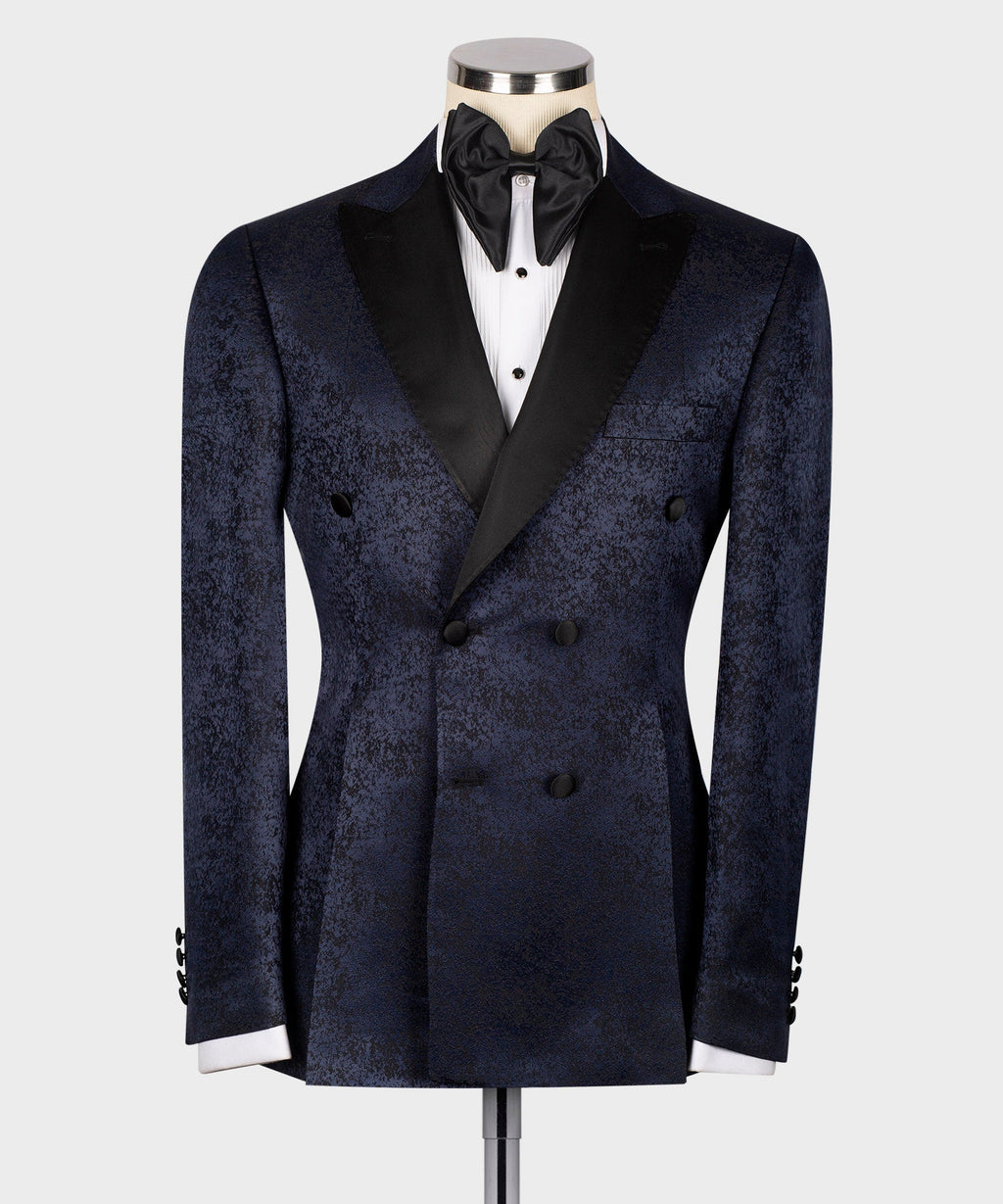 Navy patterned tuxedo jacket with black satin lapels and bow tie, front view on mannequin