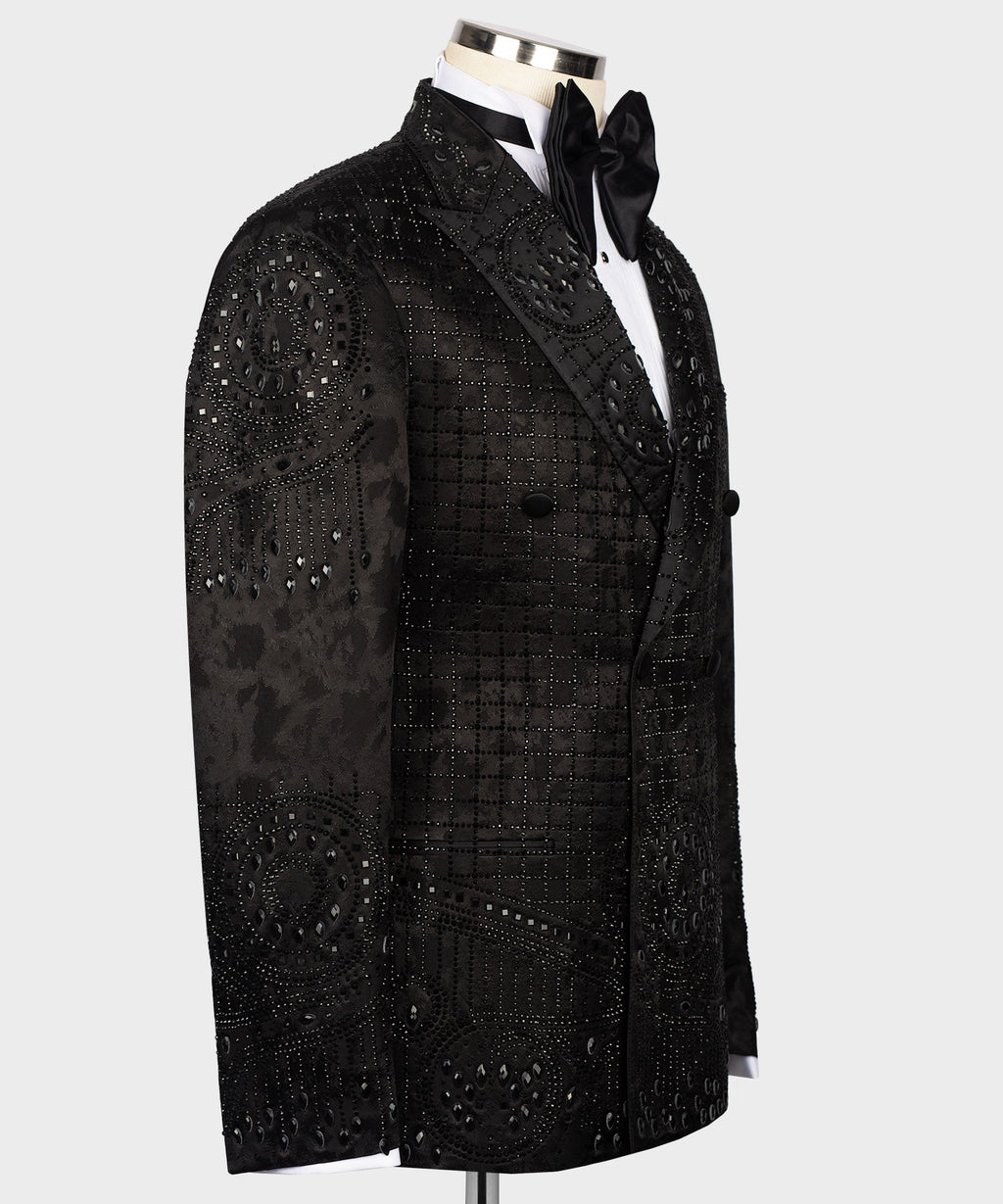 Black tuxedo jacket with embroidered motifs along lapel and chest; bow tie visible