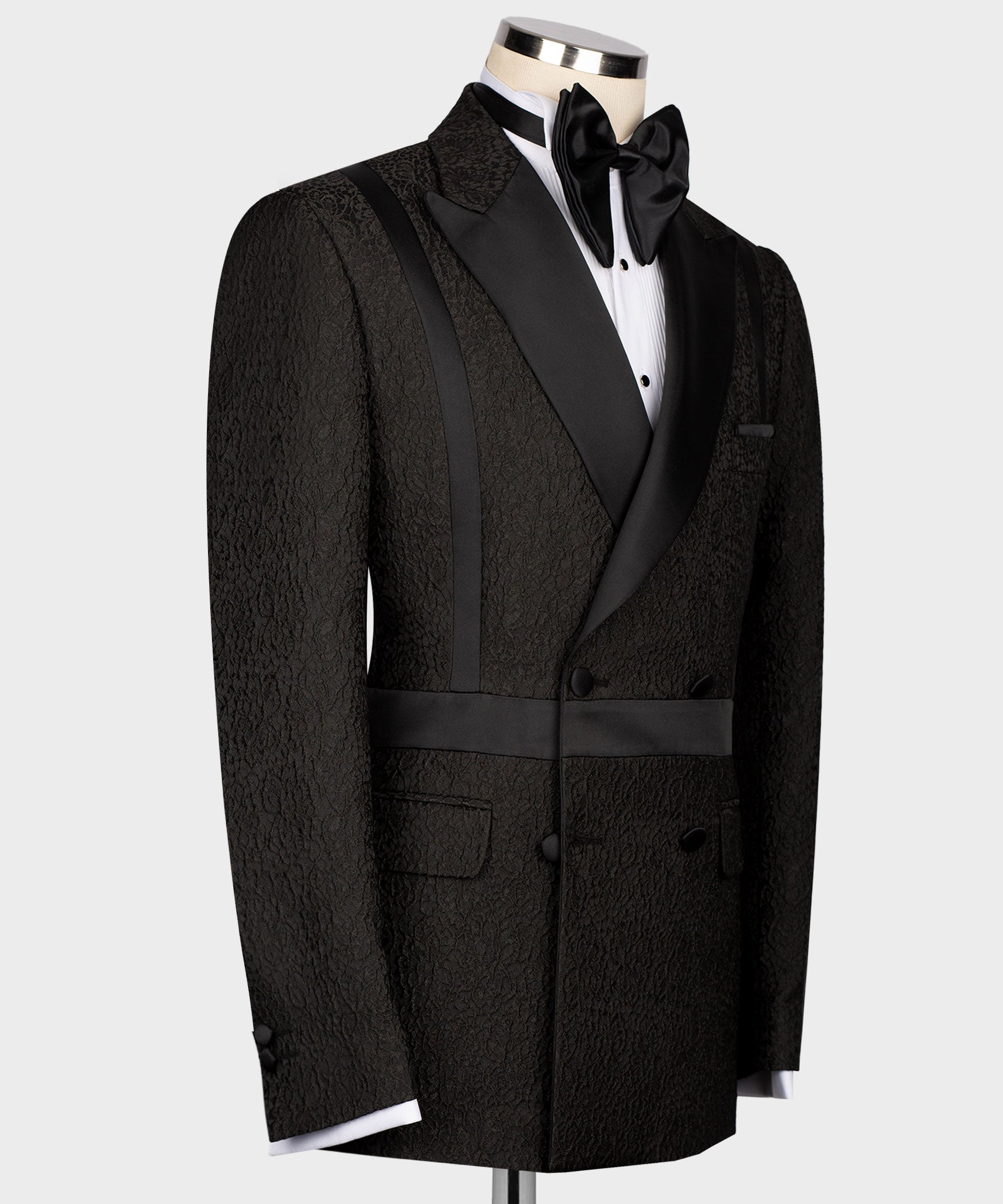 Black double-breasted tuxedo jacket side view with self belt and textured fabric