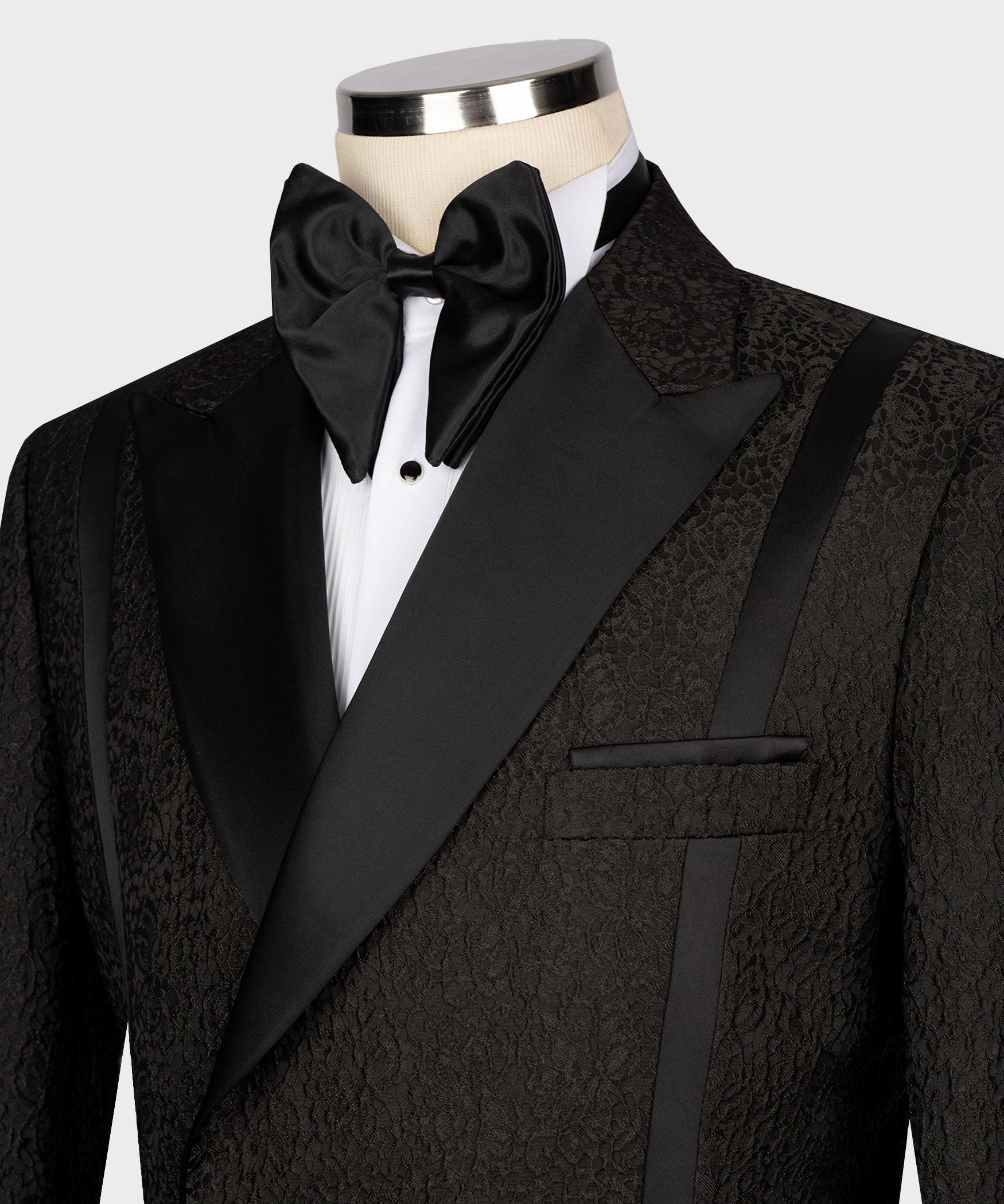 Black tuxedo bow tie and satin shawl lapels with double-breasted front
