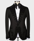 Black custom tuxedo jacket with jeweled lapels, satin bow tie, and white vest