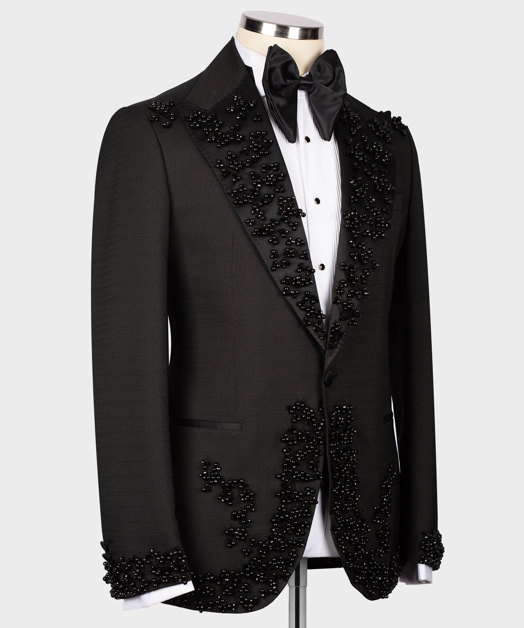 Black tuxedo jacket with embellished V-shaped vest front and satin bow tie