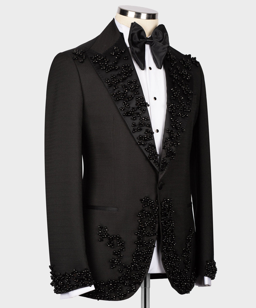 Black tuxedo set with embellished lapels and satin bow tie, front view on mannequin