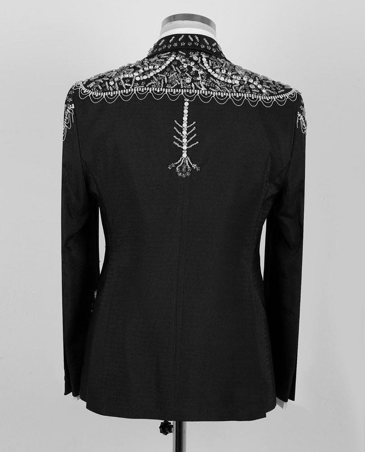 Black tuxedo jacket back with ornate silver beadwork yoke and center embellishment