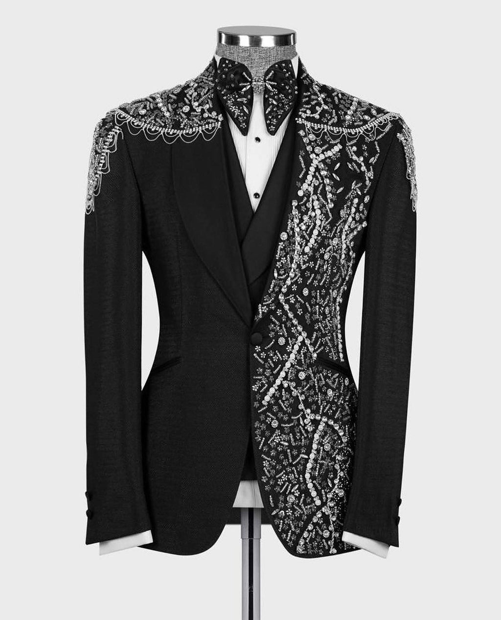 Black tuxedo jacket with crystal-like beaded embroidery and bow-tie neck detail