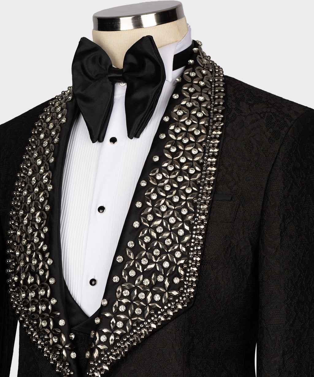 Crystal-studded lapel and front of black tuxedo jacket with satin bow and vest buttons