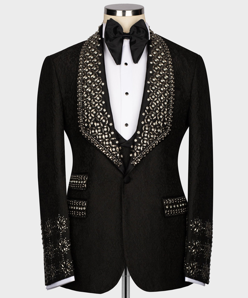Black tuxedo jacket with crystal-encrusted lapels and satin bow tie, on white shirt