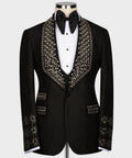 Black tuxedo jacket with crystal-encrusted lapels and satin bow tie, on white shirt