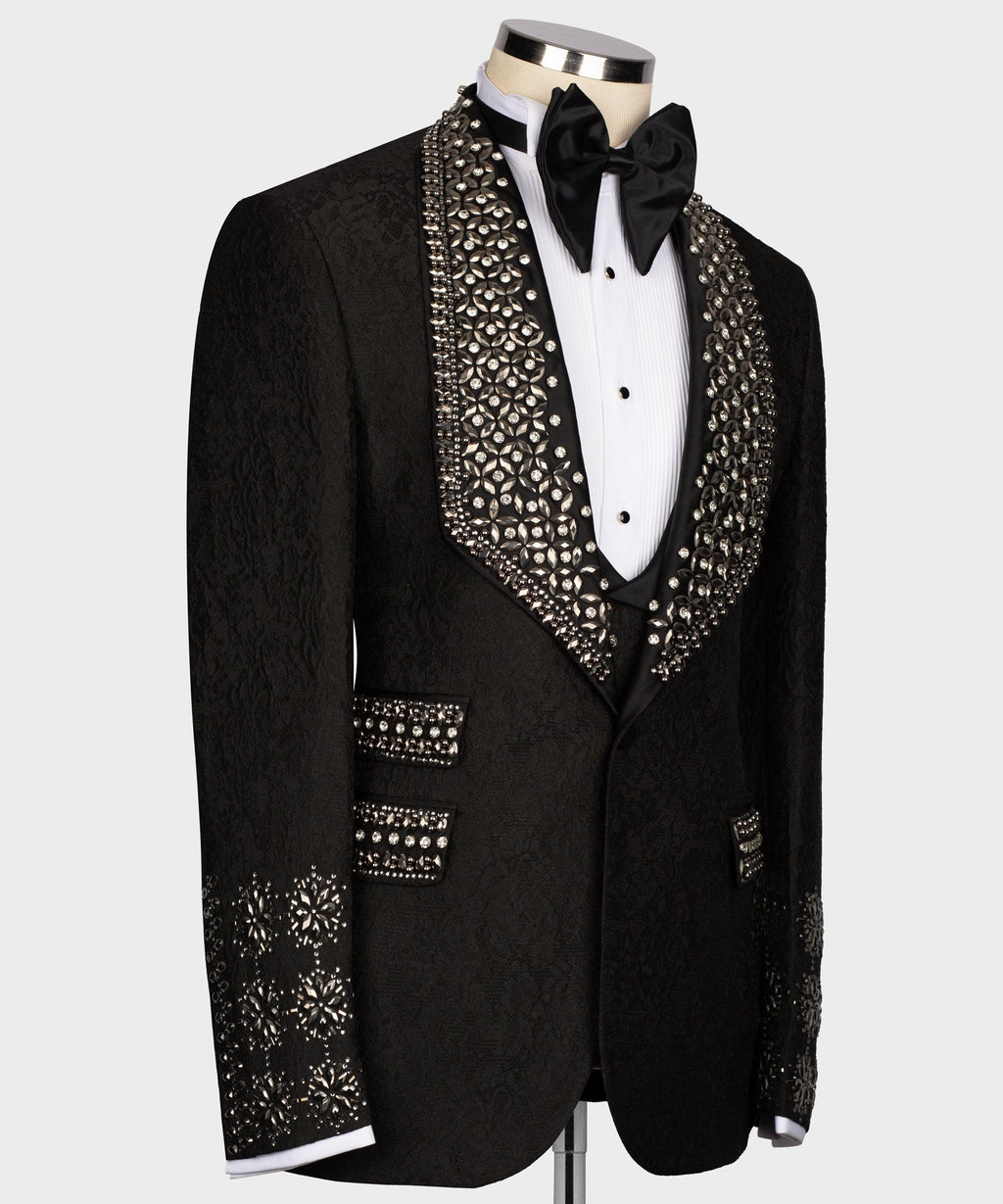 Black tuxedo jacket with crystal-embellished trim and satin bow tie, on buttoned vest