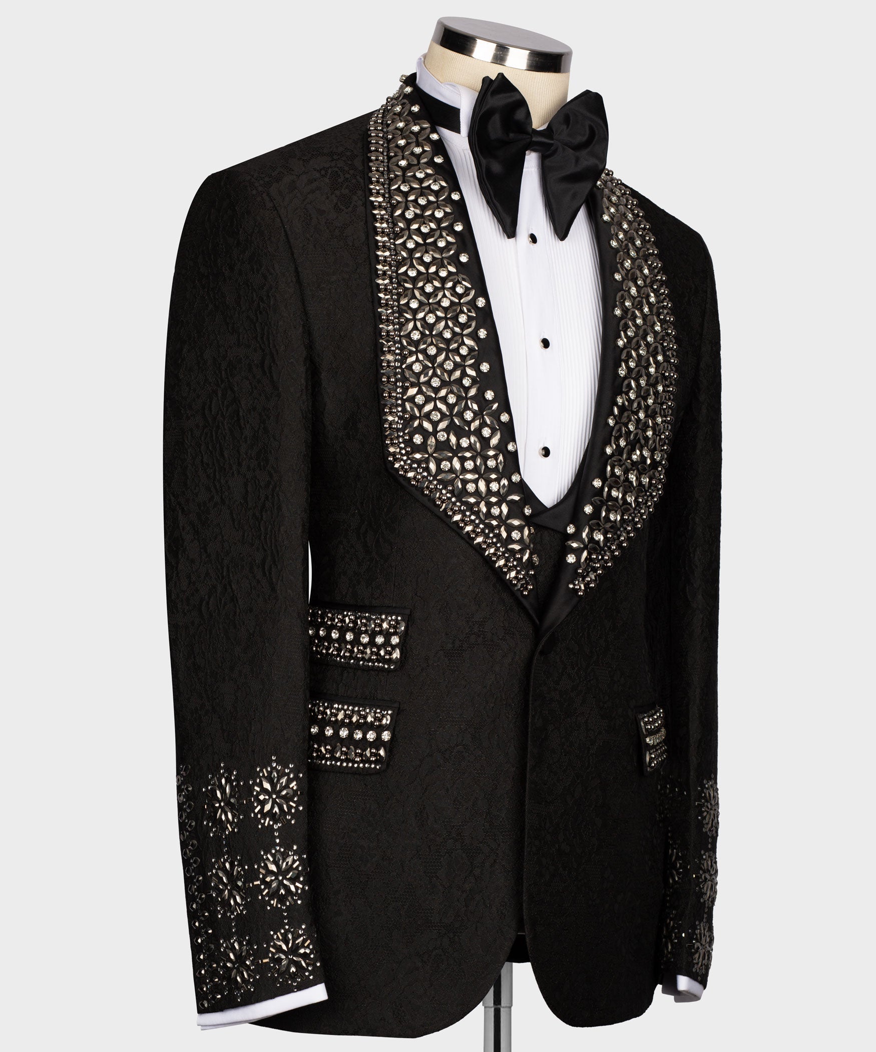 Black tuxedo jacket with crystal-embellished trim and satin bow tie, on buttoned vest