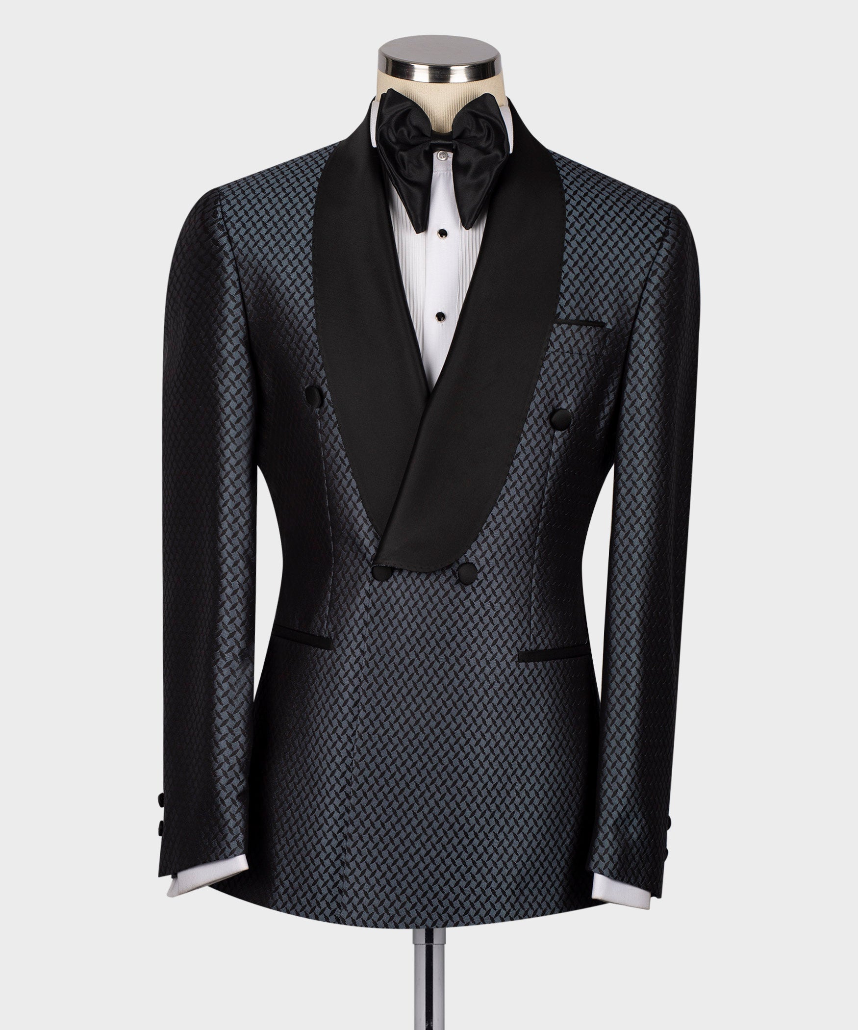 Black tuxedo jacket with blue geometric pattern, satin lapels and black bow tie