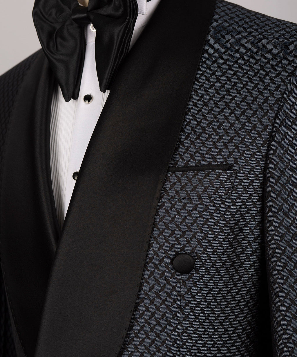 Close-up of satin black lapel, bow tie and patterned chest pocket on tuxedo jacket