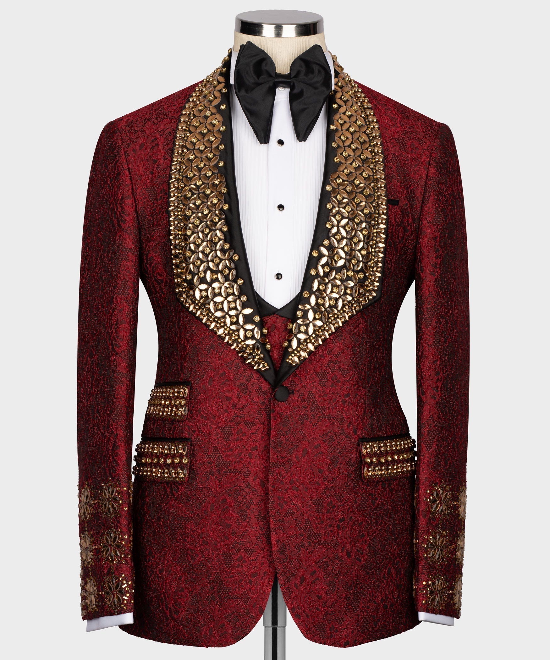 Red silk tuxedo jacket with gold jeweled lapels, black bow tie, white shirt and vest