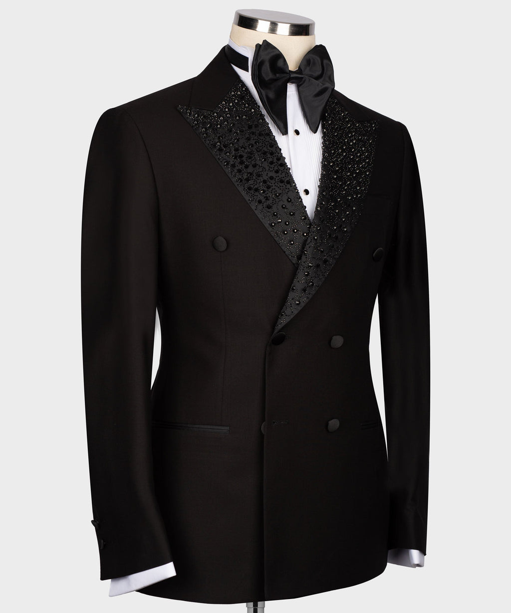 Black tuxedo jacket with embellished lapel detailing and satin bow tie