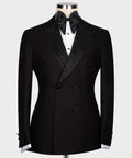 Black tuxedo jacket with gemstone-embroidered lapels, black bow tie, double-breasted front