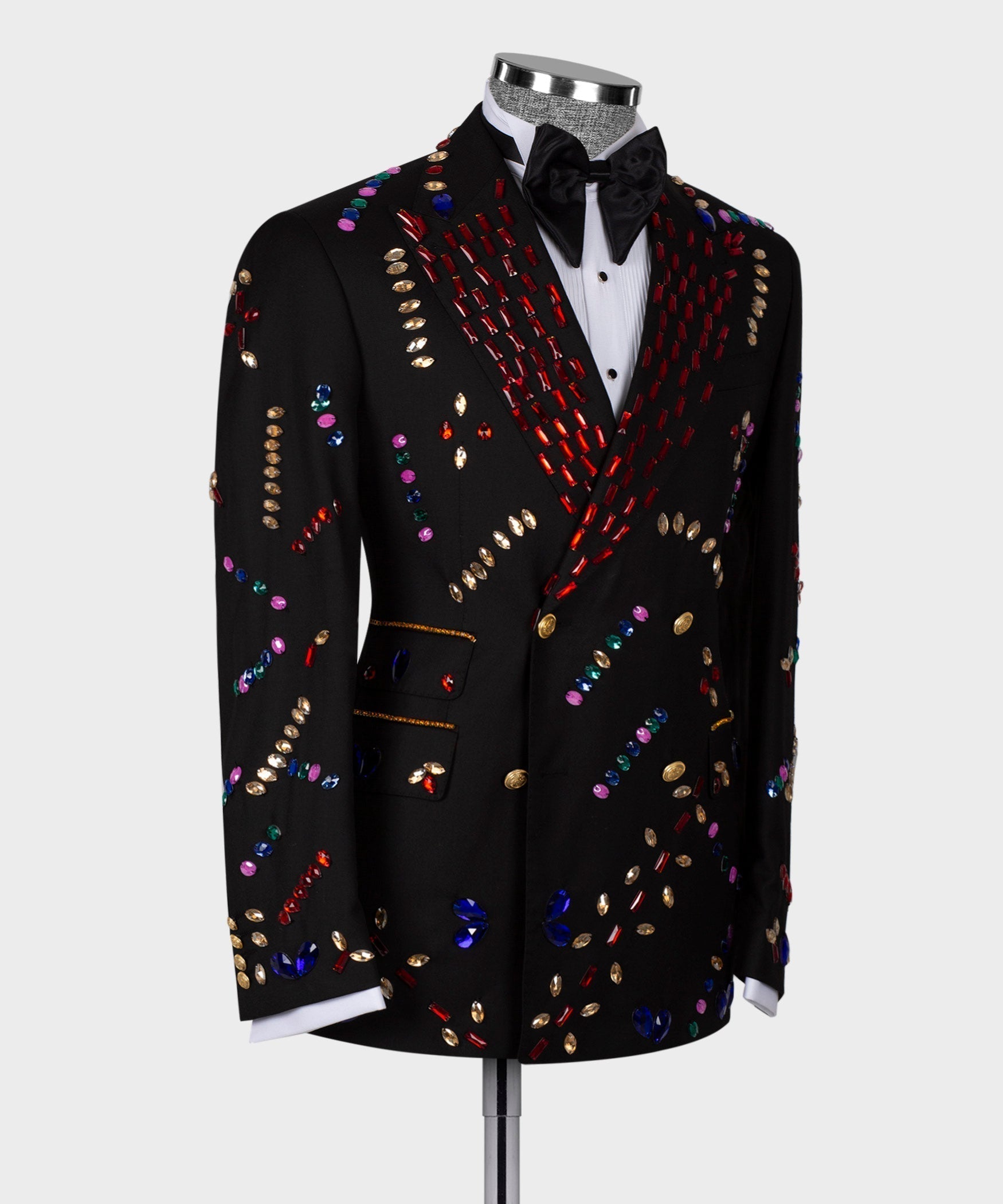 Black tuxedo jacket with multicolor crystal stripe detail; white shirt and black bow