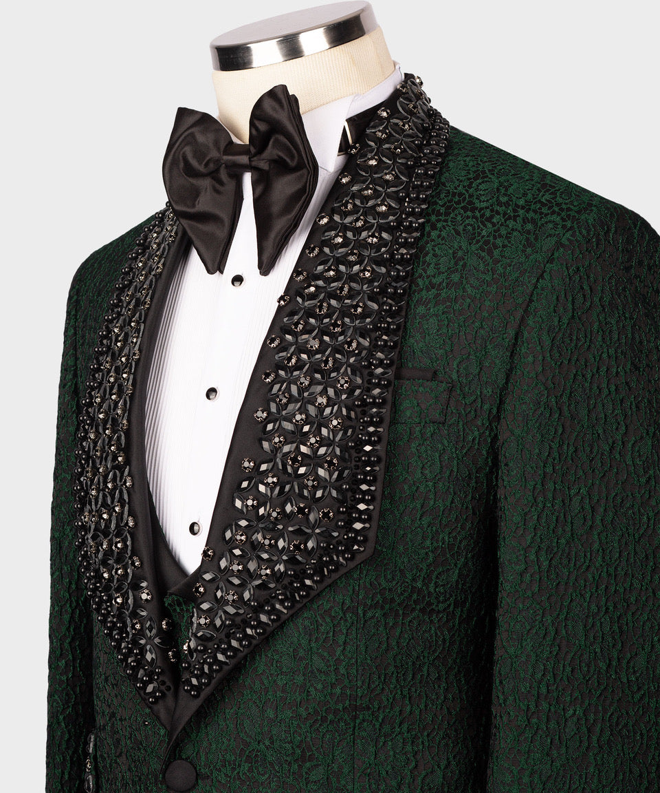 Green textured tuxedo jacket with black satin bow tie, studded beaded lapel, and white shirt