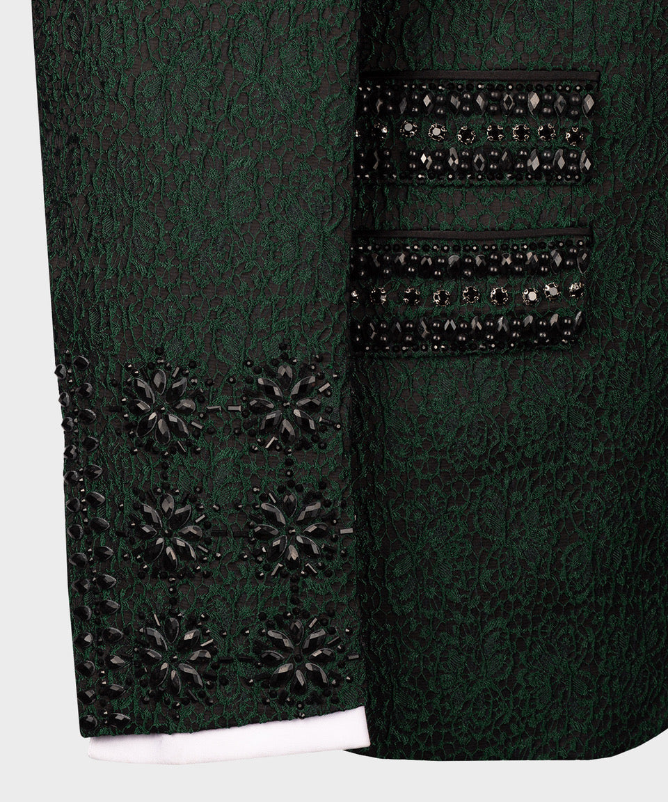 Close-up green tuxedo sleeve and pocket flap with black jeweled trim