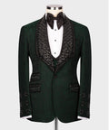 Dark green tuxedo jacket with black embellished lapels, white shirt, black bow tie