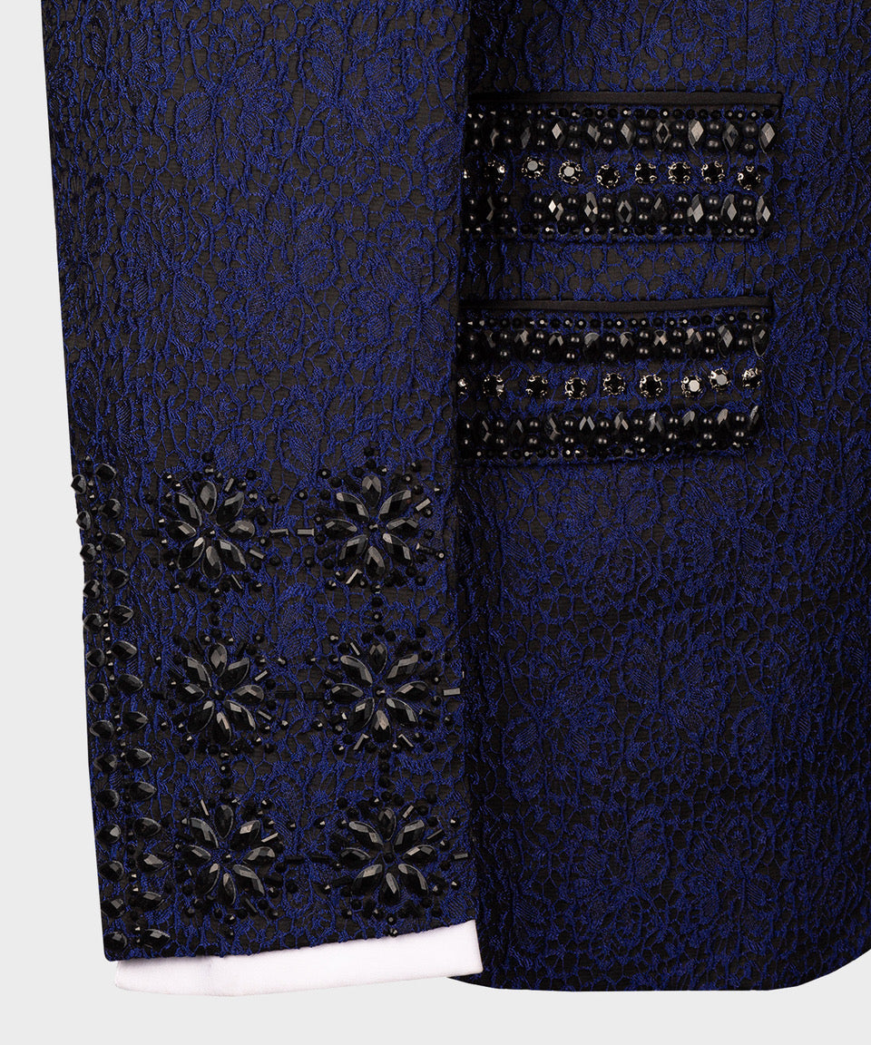 Sleeve cuff and hem detail: dark blue jacket with black crystal floral embellishment